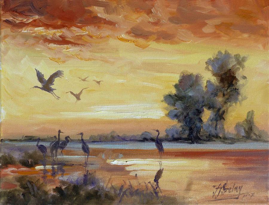 Sunset on the marshes with cranes Painting by Irek Szelag