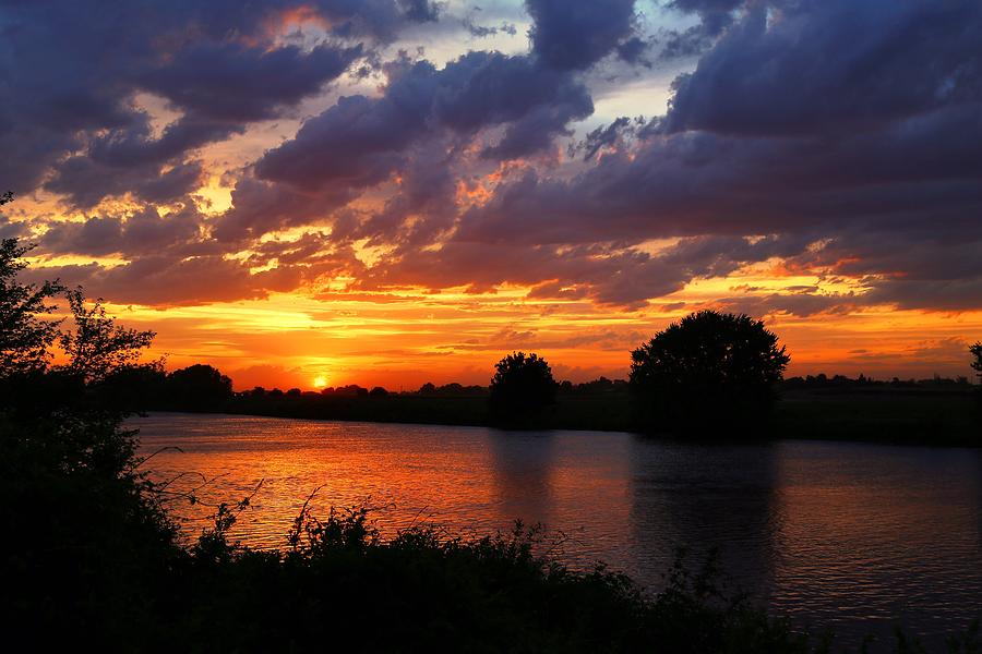 Sunset on the river Photograph by Lynn Hopwood