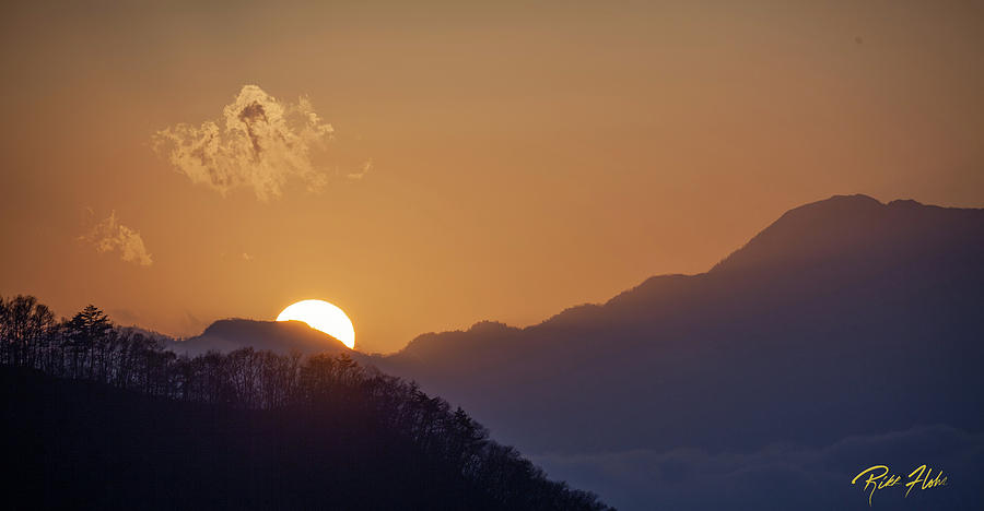 Sunset over Asia  Photograph by Rikk Flohr