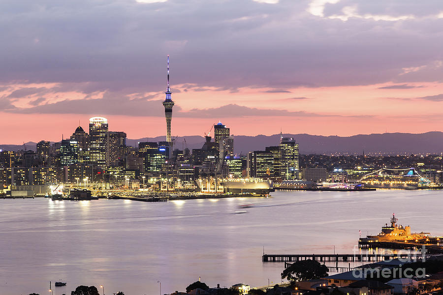 Sunset over Auckland business district in New Zealand Photograph by Didier Marti