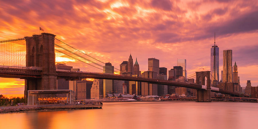 Sunset Over Brooklyn Bridge In New York City Skyline Panorama