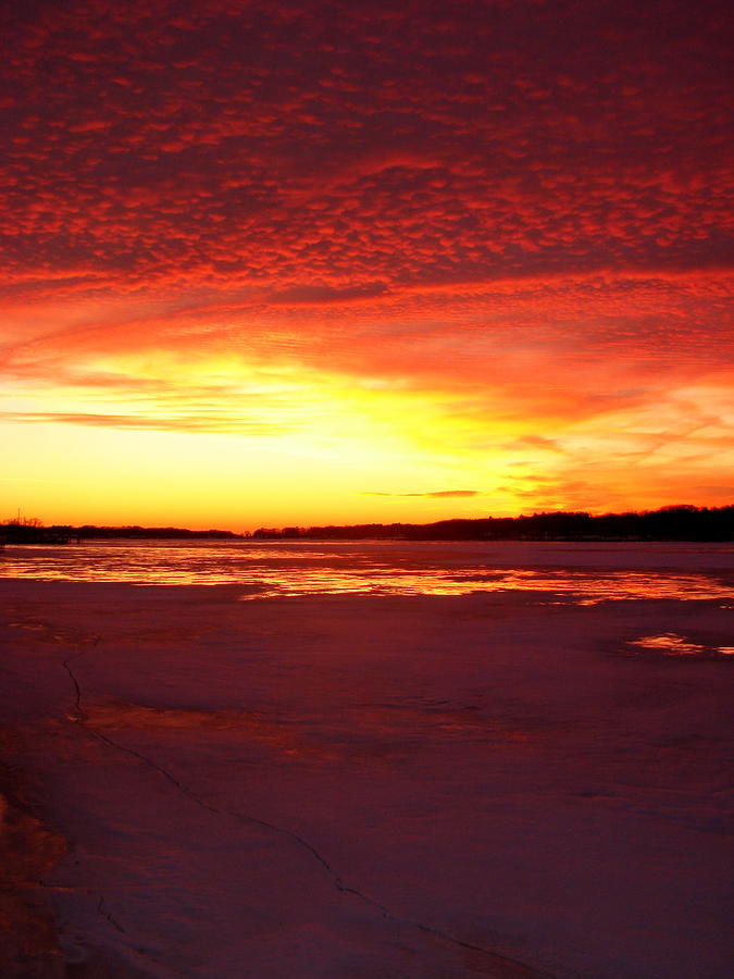 Sunset over Frozen Lake Macatawa Photograph by Michelle Calkins