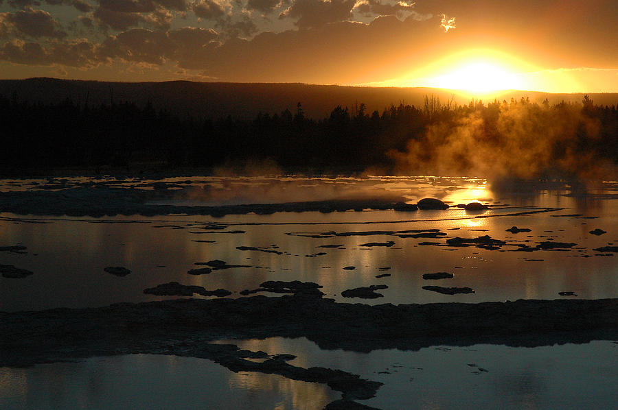 Sunset Over Great Fountain Geyser in Yellowstone National Park Photograph by Bruce Gourley