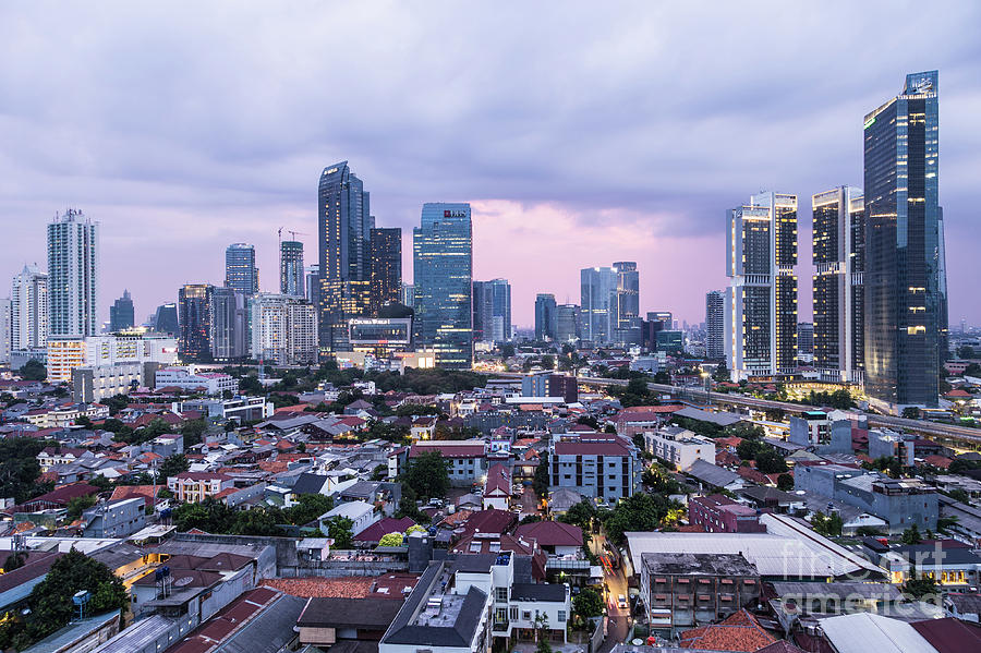Sunset over Jakarta business district in Indonesia capital city. Photograph by Didier Marti