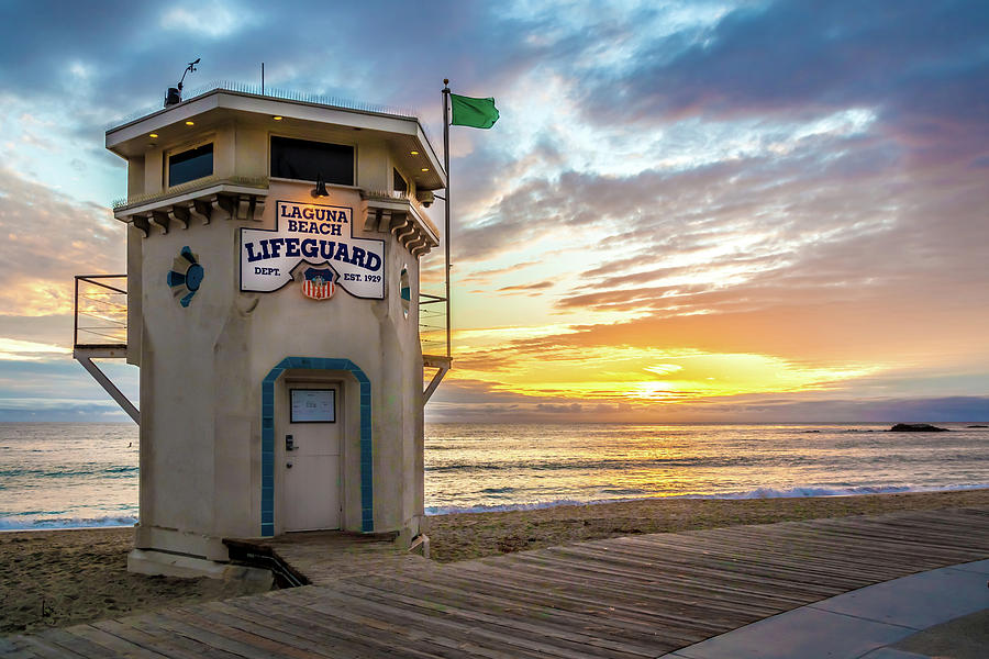 Sunset over Laguna Beach Lifeguard Station Photograph by Cliff Wassmann