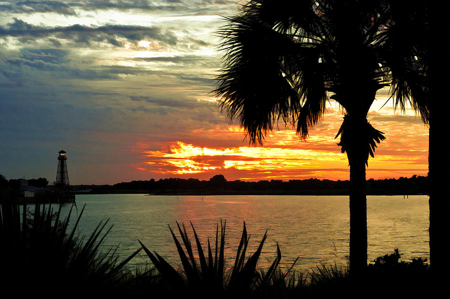 Sunset over Lake Sumter Landing Photograph by Betty Eich