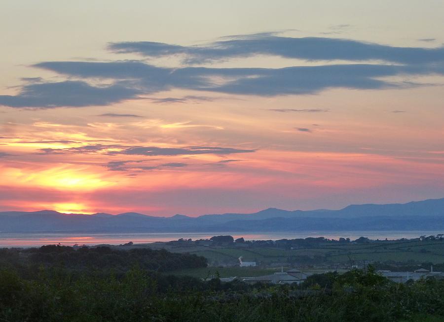 Sunset over Morecambe Bay and the Lakeland Fells Photograph by Nigel Radcliffe