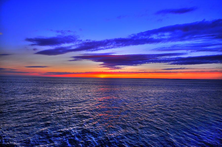Sunset Photograph - Sunset over ocean by Quentin Griffin