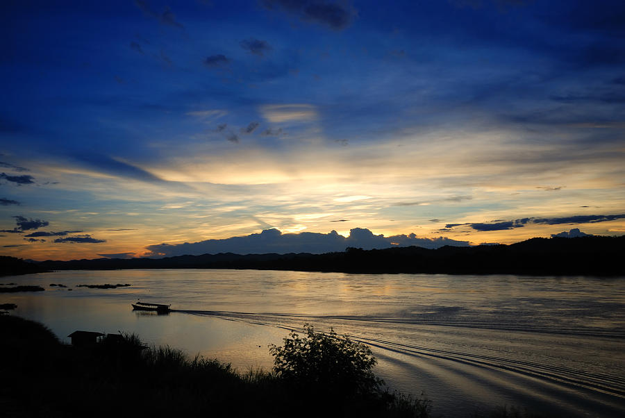 Nature Photograph - Sunset over river Khong by Natapong Paopijit