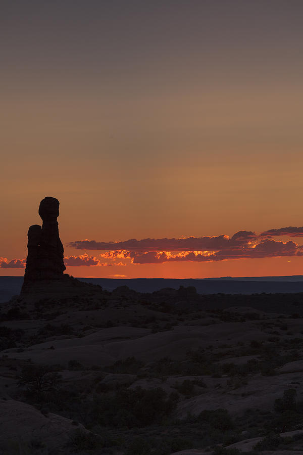 Sunset over rock formation Photograph by David Watkins