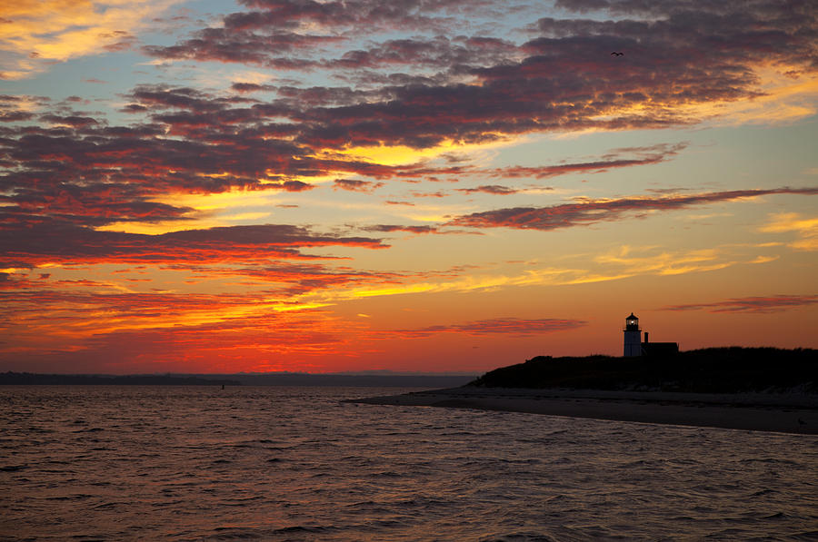 Sunset over Sandy Neck Lighthouse Photograph by Charles Harden