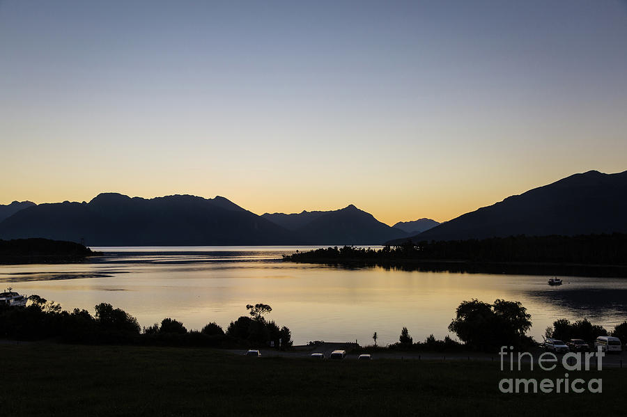 Sunset over Te Anau lake in New Zealand Photograph by Didier Marti