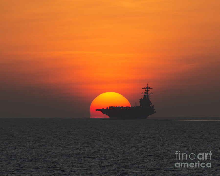 Sunset over the aircraft carrier  Photograph by Celestial Images
