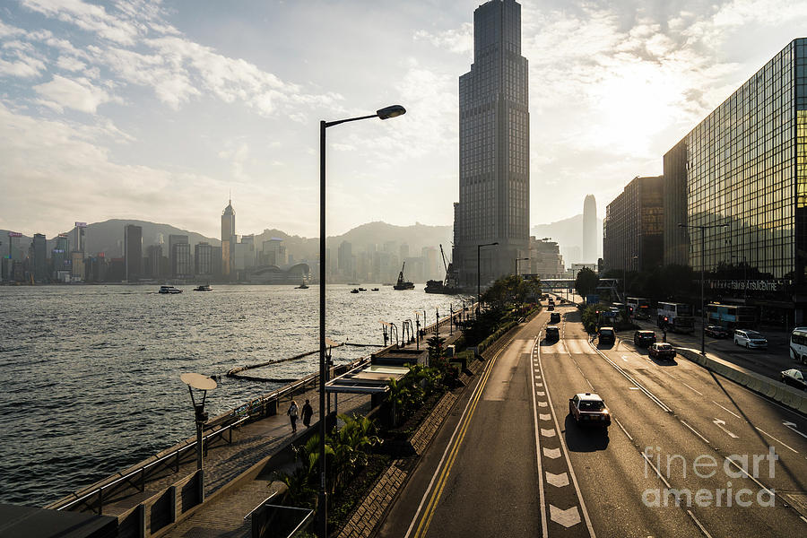 Sunset over the coastal road along the Victoria harbour in Hong  Photograph by Didier Marti