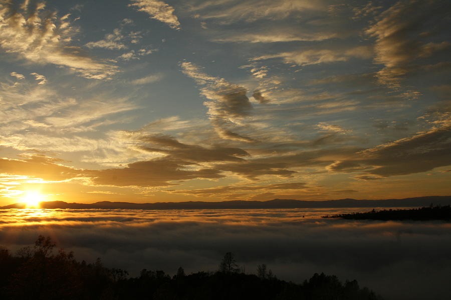 Sunset over the valley fog Photograph by Suzanne Lorenz