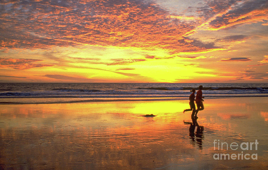 Sunset Ocean Runners Photograph