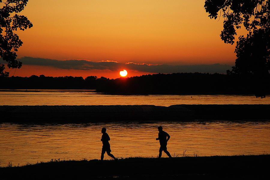Sunset Runners Photograph by James Kirkikis
