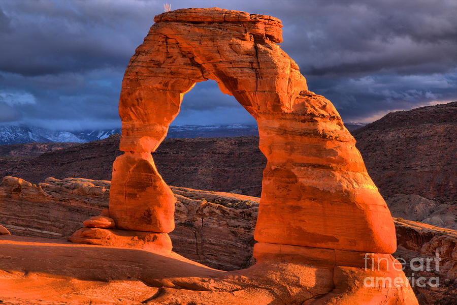Sunset Storms Over Delicate Arch Photograph by Adam Jewell