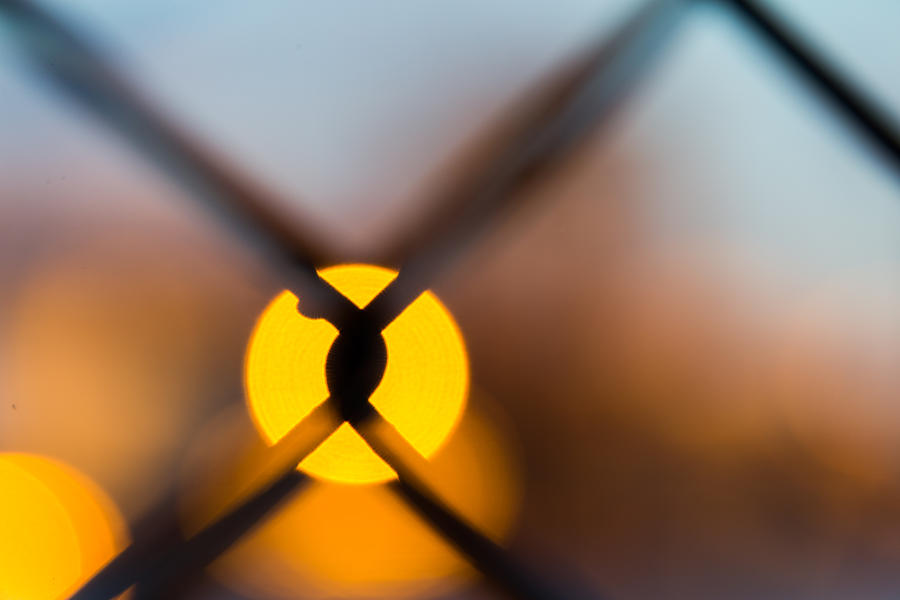 Sunset Through Chain Link Fence Photograph by SR Green