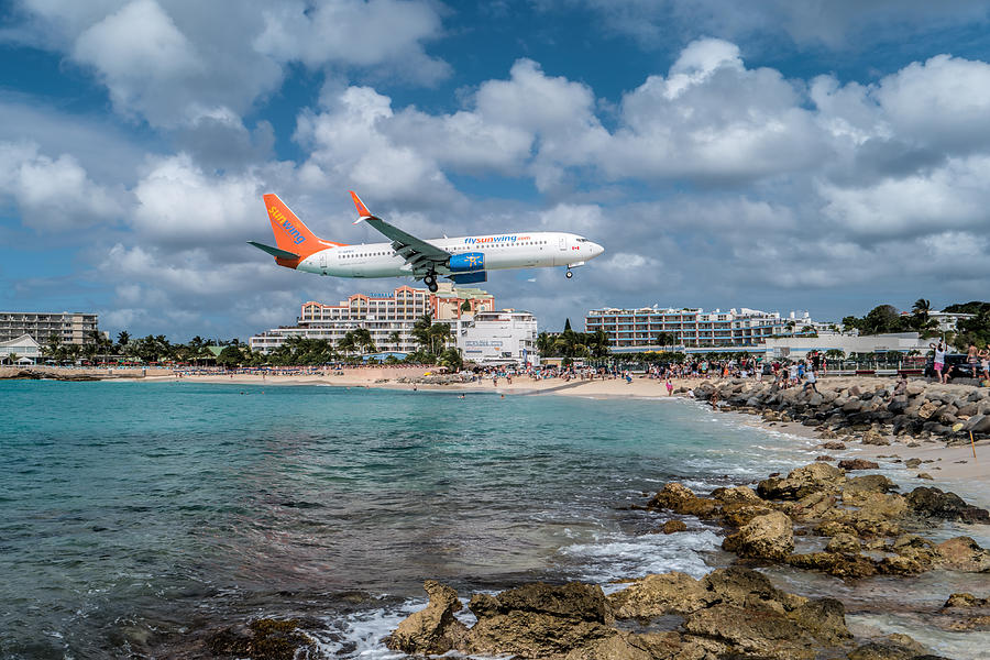 Sunwing Airlines arriving at St. Maarten airport. Photograph by David Gleeson