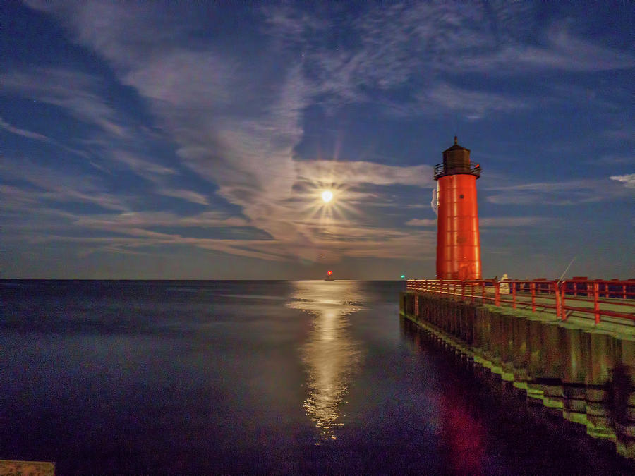 Supermoon over the red lighthouse Photograph by Kristine Hinrichs