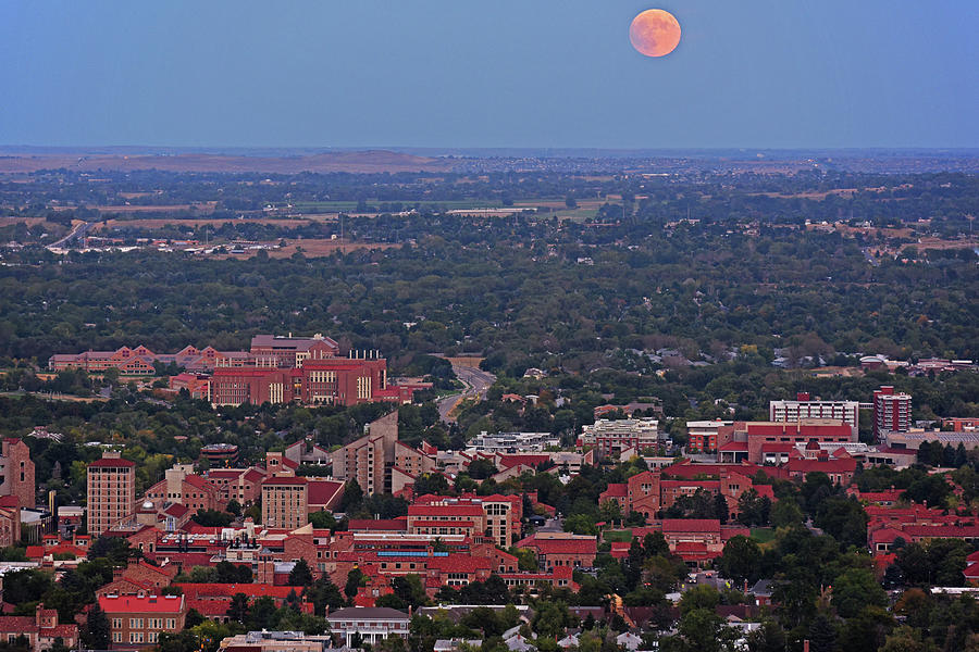 Supermoon rising over the University of Boulder Colorado Photograph by Toby McGuire