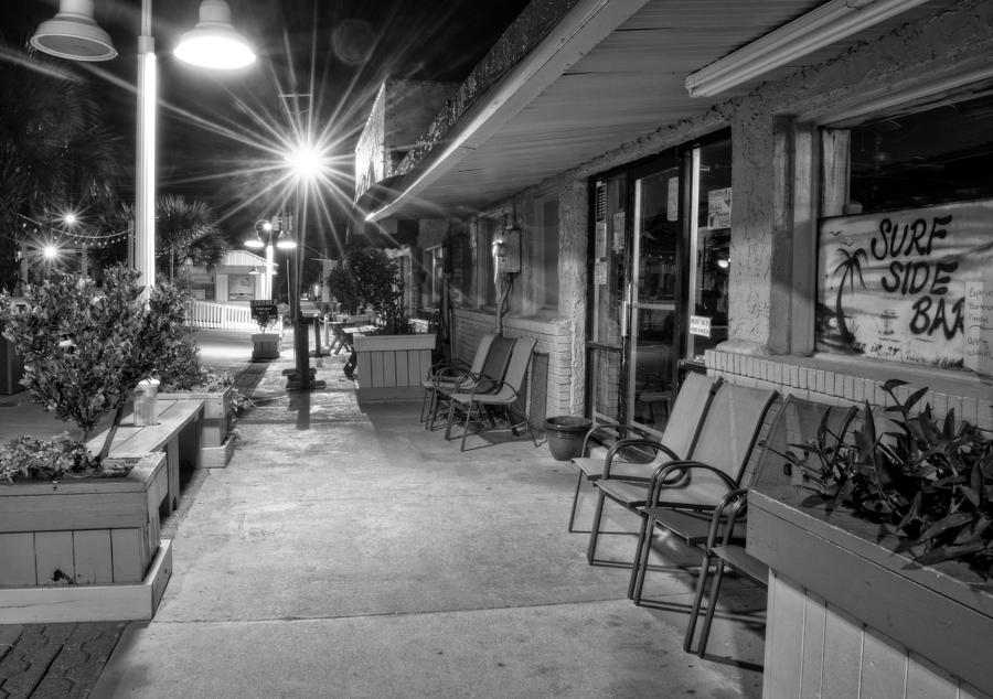 Surf Side Bar At Night in Black and White Photograph by Greg and Chrystal Mimbs