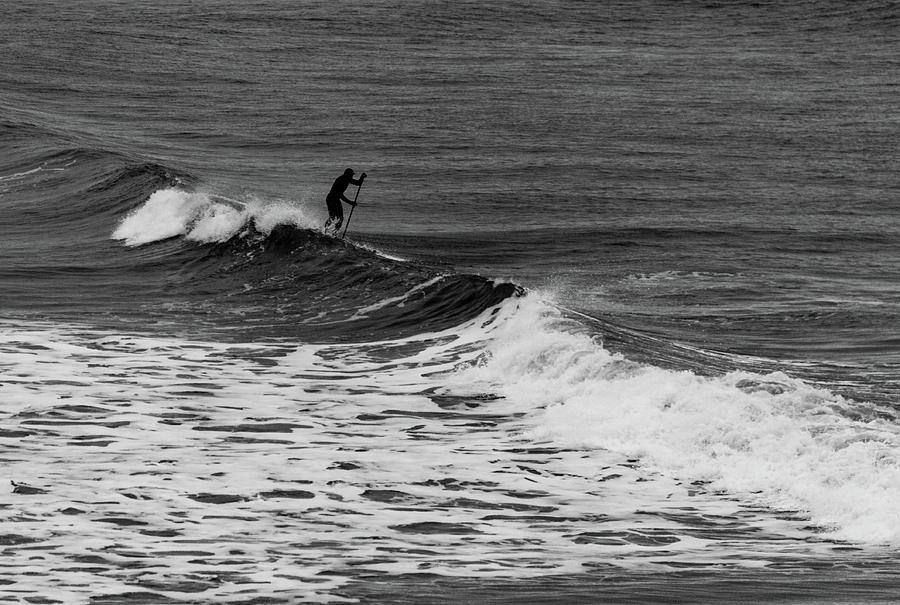Surfer negotiating the Waves Photograph by Iordanis Pallikaras