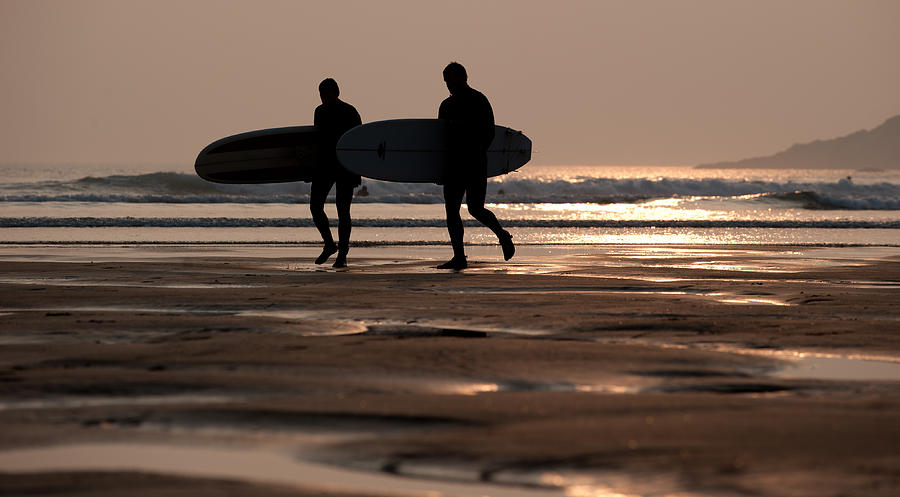 Surfers at Sunset Photograph by Helen Jackson
