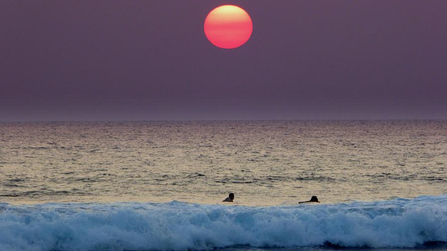Surfers at Sunset Photograph by Lori Seaman