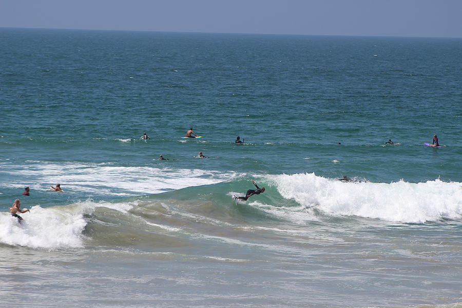 Surfers in Pacific Ocean Photograph by Colleen Cornelius