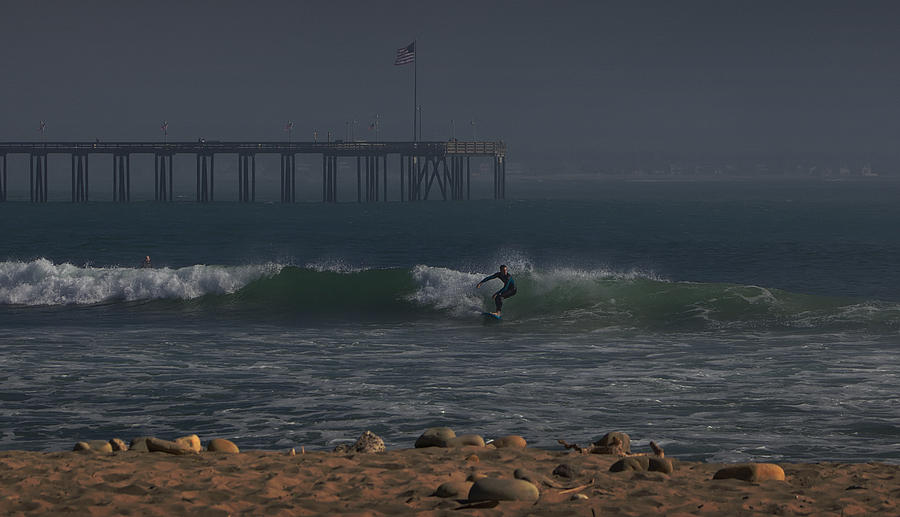 Surfing the Pier Photograph by Michael Gordon