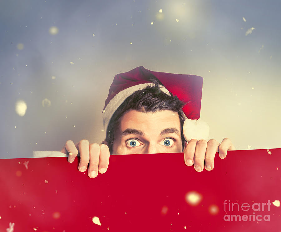 Surprised santa elf holding red christmas board Photograph by Jorgo Photography