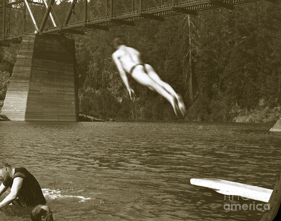 Men Photograph - Swimming and diving in Russian River with Railroad Bridge across by Monterey County Historical Society
