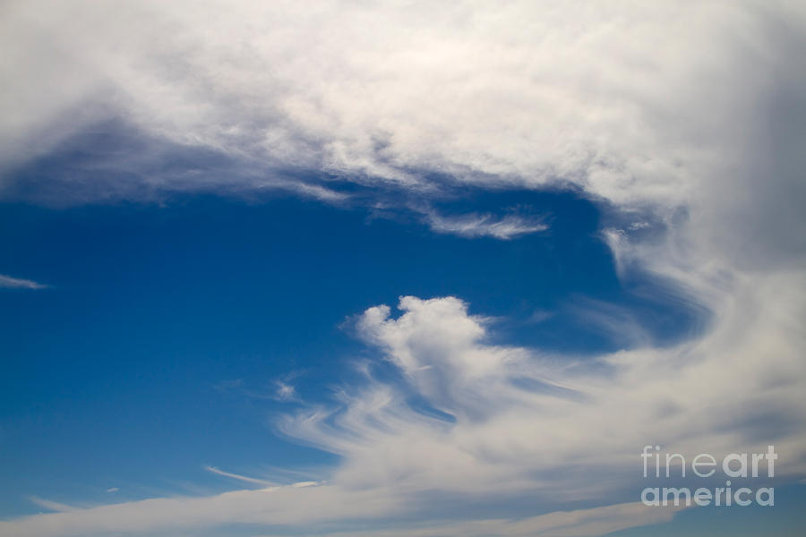 Swirl of Clouds in a Blue Sky Photograph by Louise Heusinkveld - Fine ...