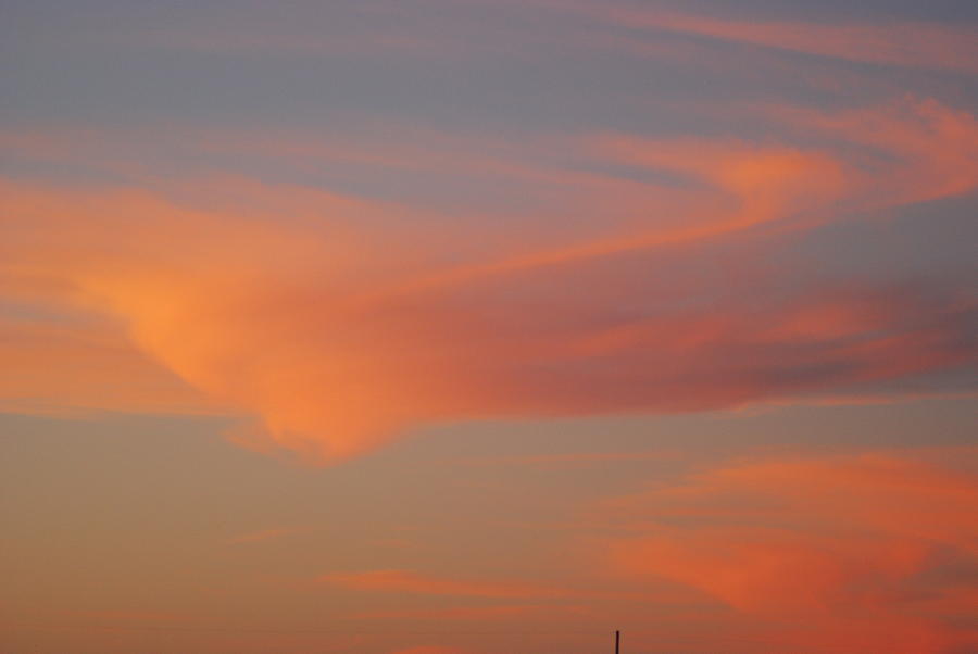 Sunset Photograph - Swirling Clouds in Evening by Wanda Jesfield