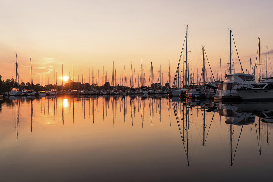 Symmetrical Peace - Catching the Sunrise at a Local Yacht Club Photograph by Georgia Mizuleva