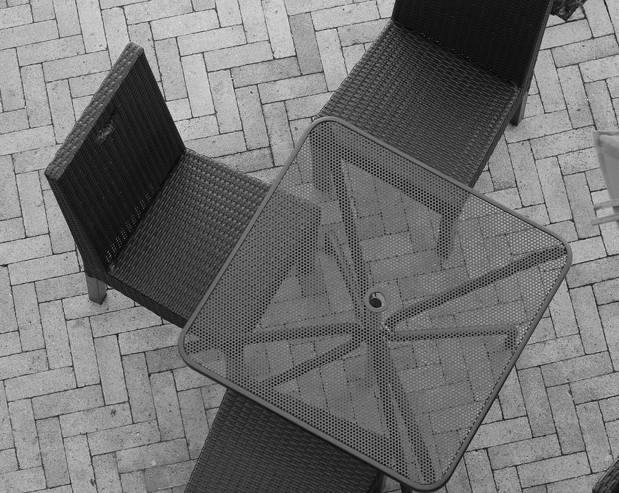 Black And White Photograph - Table Chairs From Above by Rob Hans