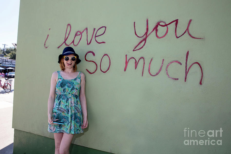 Austin Photograph - Taking a picture in front of the famous I love you so much mural by Dan Herron