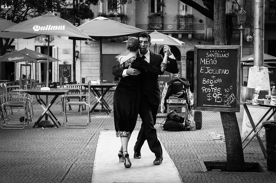 Black And White Photograph - Tango in the Plaza by Jose Vazquez