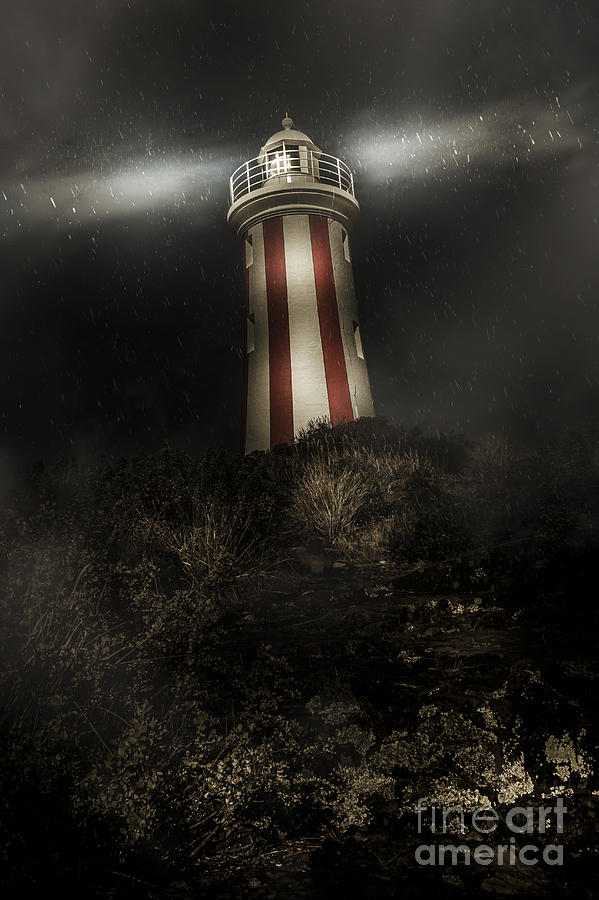 Tasmania lighthouse in rain storm. Guiding light Photograph by Jorgo Photography