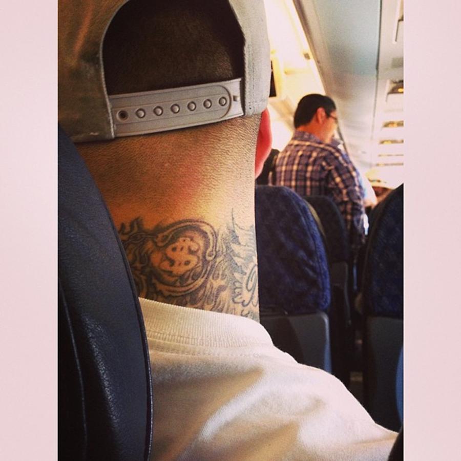 Miami Photograph - Tattooed Neck On Plane #juansilvaphotos by Juan Silva