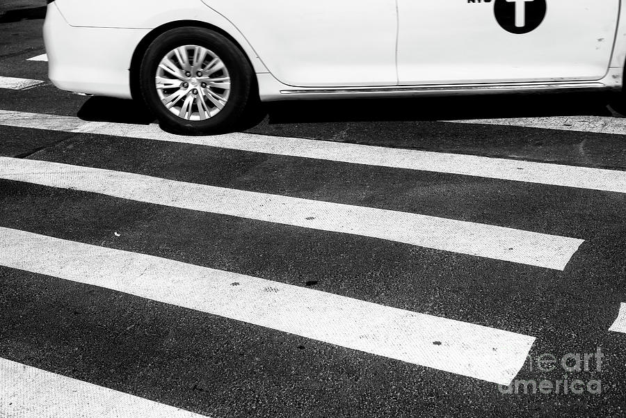Taxi Crossing New York City Photograph by John Rizzuto