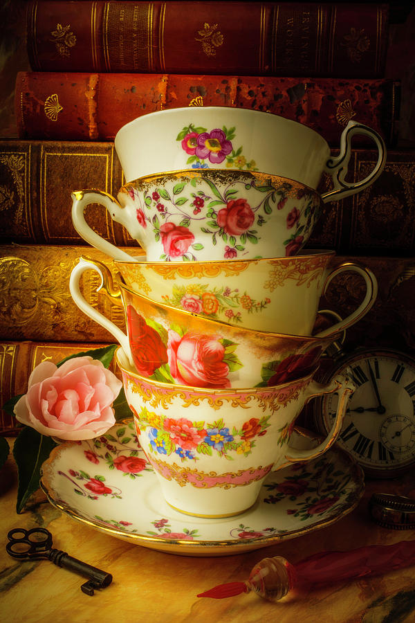 Tea Cups And Antique Books Photograph by Garry Gay