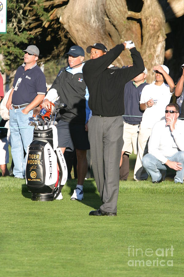 what time is tiger teeing off today