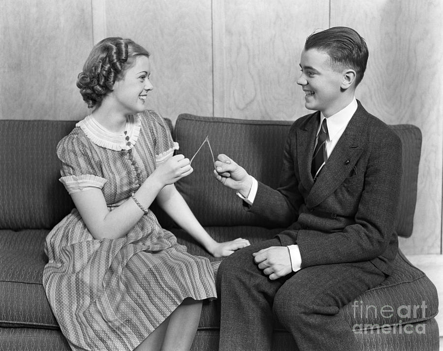 Teen Couple Pulling Wishbone, C.1930s Photograph by H. Armstrong Roberts/ClassicStock