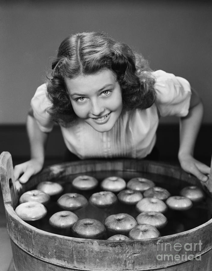 Teen Girl Bobbing For Apples, C.1940s Photograph by H. Armstrong Roberts/ClassicStock