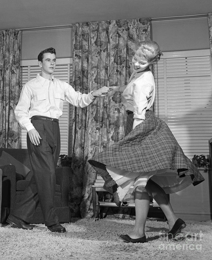 Teenage Couple Dancing Jitterbug Photograph by Debrocke/ClassicStock