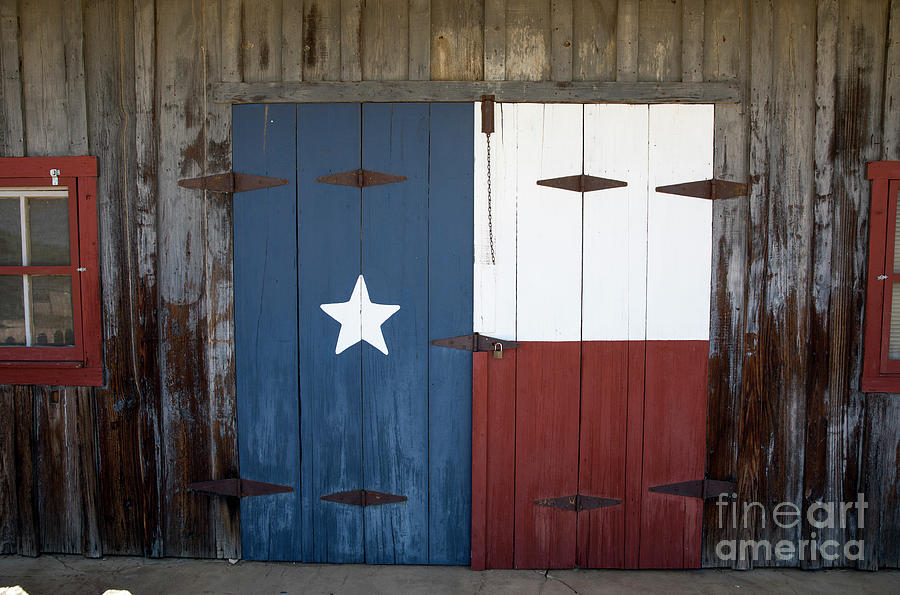 Flag Photograph - Texas LoneStar Flag painted on a barn door in the Texas Hill Country by Dan Herron