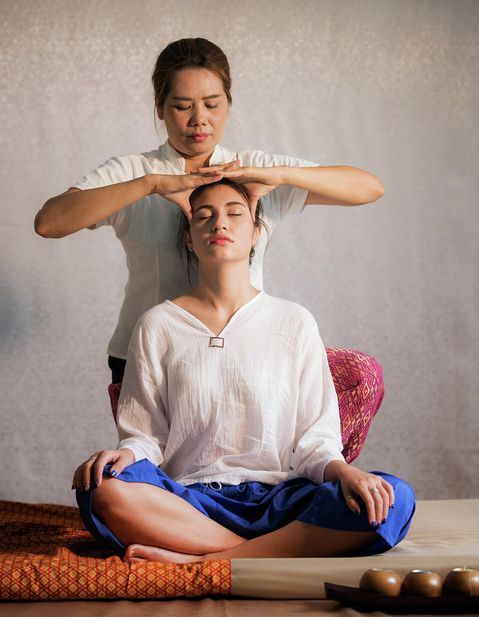 Thai original head massage  Photograph by Anek Suwannaphoom